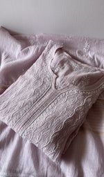 Folded kurta piece and dupatta, chikankari along the hem