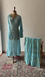 Turquoise pure mul chanderi chikankari suit set on the mannequin with its dupatta