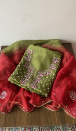 Folded green pure organza silk kurta piece with chikankari on the panel