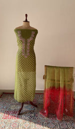 Green pure organza silk chikankari suit set on the mannequin with its dupatta