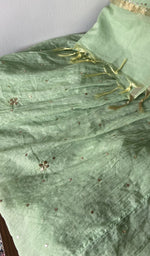 Hem and border of the green dupatta