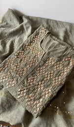 Folded green pure mul chanderi kurta piece with chikankari on the panel