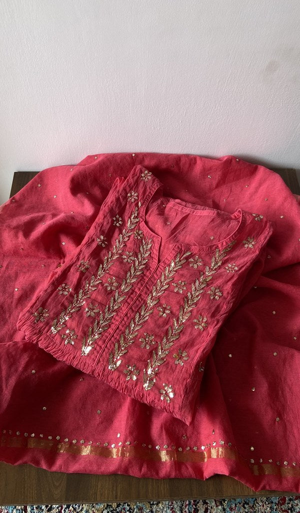 Folded red pure mul chanderi kurta piece with chikankari on the panel