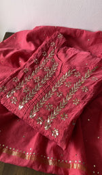 Folded kurta piece and dupatta, chikankari along the hem