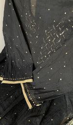 Folded black pure mul chanderi kurta piece with chikankari on the panel