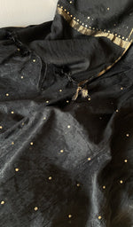 Hem and border of the black dupatta