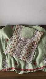 Folded green pure mul chanderi kurta piece with chikankari on the panel