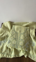 Folded green pure mul chanderi kurta piece with chikankari in white thread on the panel