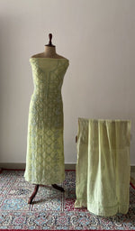 Green pure mul chanderi chikankari suit set on the mannequin with its dupatta