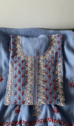 Folded kurta piece and dupatta, chikankari in red thread along the hem