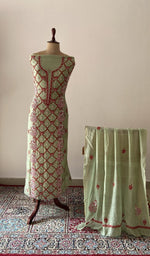 Green pure mul chanderi chikankari suit set on the mannequin with its dupatta