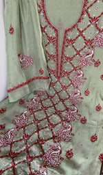 Sleeve work in red thread on green pure mul chanderi