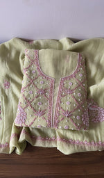 Folded green pure mul chanderi kurta piece with chikankari in pink thread on the panel