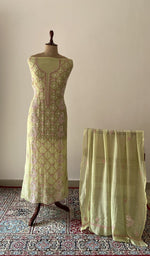 Green pure mul chanderi chikankari suit set on the mannequin with its dupatta