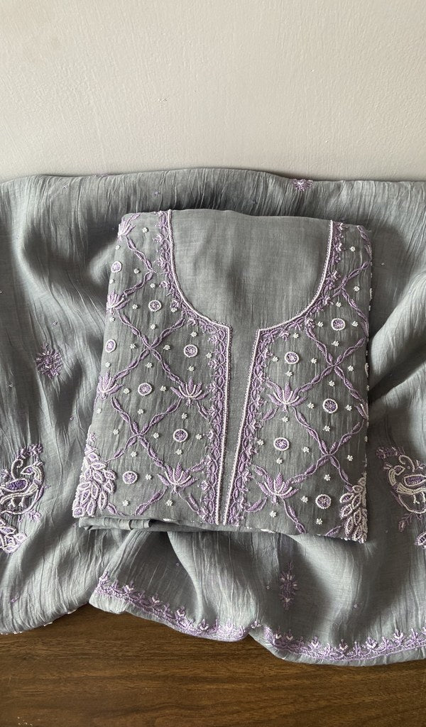 Folded grey pure mul chanderi kurta piece with chikankari on the panel