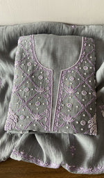 Folded kurta piece and dupatta, chikankari along the hem