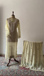 Yellow pure mul chanderi chikankari suit set on the mannequin with its dupatta