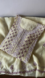 Folded kurta piece and dupatta, chikankari in lilac thread along the hem