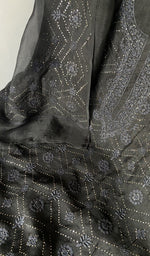 Motifs across the body of the black kurta