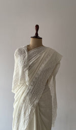 Pallu falling over the shoulder, extremely fine ek and do taar chikankari