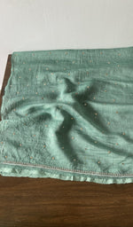 Hem and border of the green dupatta