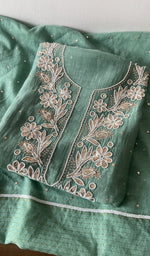 Folded kurta piece and dupatta, chikankari along the hem