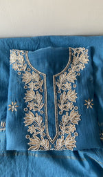 Folded kurta piece and dupatta, chikankari along the hem