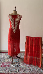 Red pure mul chanderi chikankari suit set on the mannequin with its dupatta