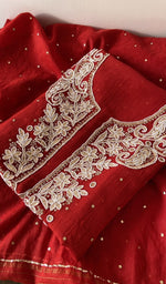 Folded kurta piece and dupatta, chikankari along the hem