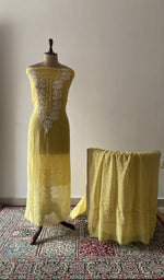 Yellow pure mul chanderi chikankari suit set on the mannequin with its dupatta