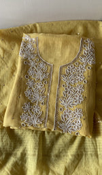 Folded kurta piece and dupatta, chikankari along the hem