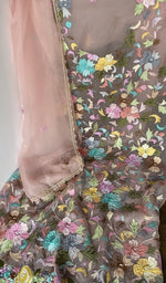 The kurta piece folded on the carpet