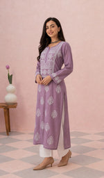 Mauve kurti from the side, styled with a white pant