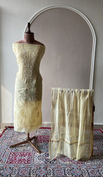 Lemon yellow mul chanderi set on the mannequin with its dupatta