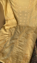 Lemon yellow mul chanderi laid out flat