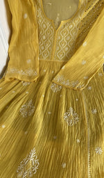 Mustard yellow mul chanderi laid flat on the table