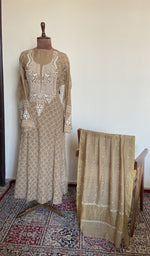 The set on the mannequin with its dupatta beside it