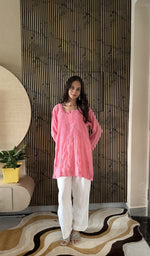 Pink muslin short kurti on the model