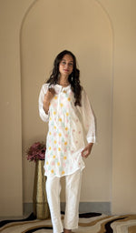 White mul chanderi short kurti on the model