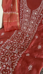 Fine chikankari on panel on the brick red mul chanderi