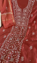 Brick red mul chanderi laid flat on the table