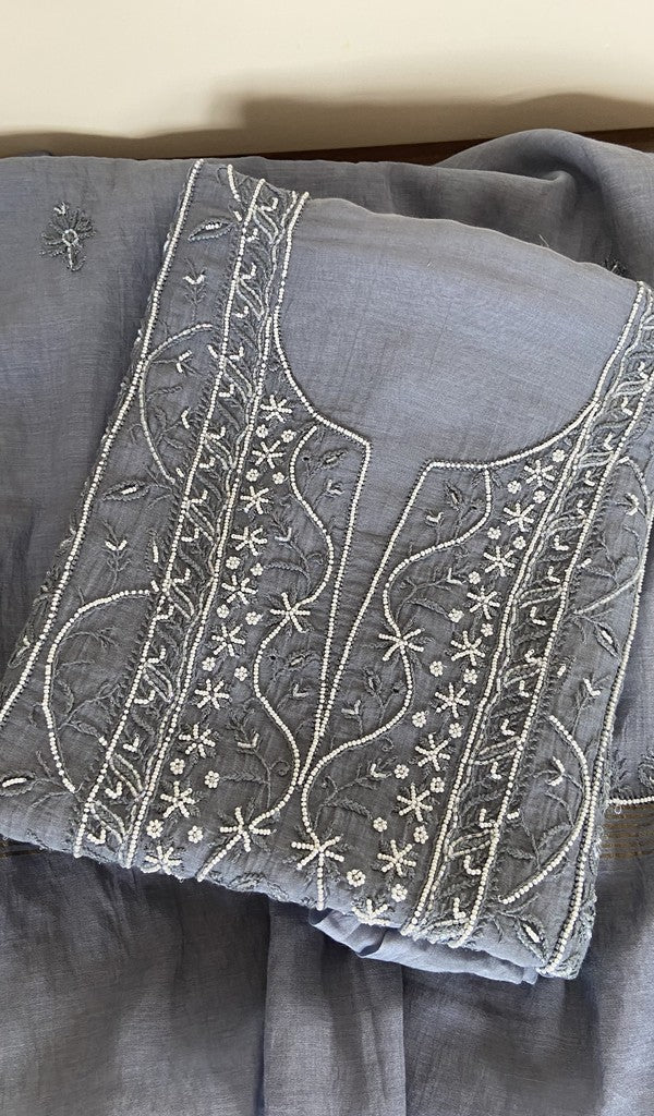 Grey pure mul chanderi kurta piece folded, fine chikankari on the panel, along with beads