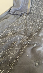 Motifs across the body of the grey kurta