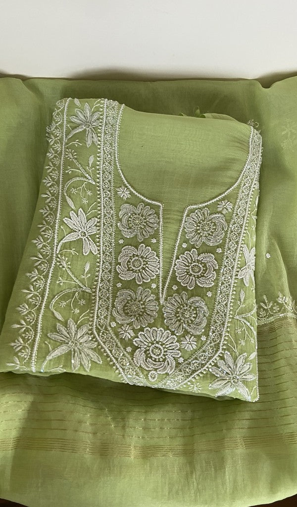 Leaf green pure mul chanderi kurta piece folded, fine chikankari on the panel, along with beads