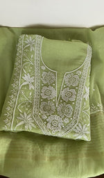 Leaf green pure mul chanderi kurta piece folded, fine chikankari on the panel, along with beads