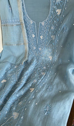 Motifs across the body of the blue kurta