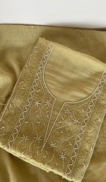 Yellow pure mul chanderi kurta piece folded, fine chikankari on the panel, along with beads