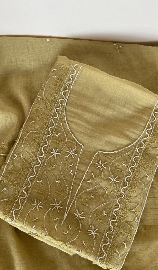 Yellow pure mul chanderi kurta piece folded, fine chikankari on the panel, along with beads