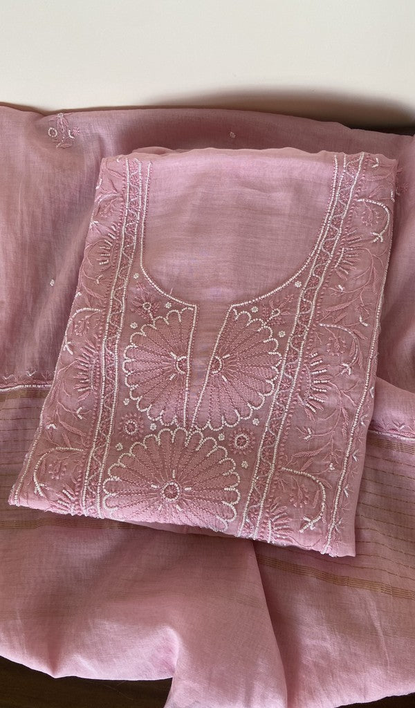 Pink pure mul chanderi kurta piece folded, fine chikankari on the panel, along with beads