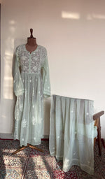 The set on the mannequin with its dupatta beside it
